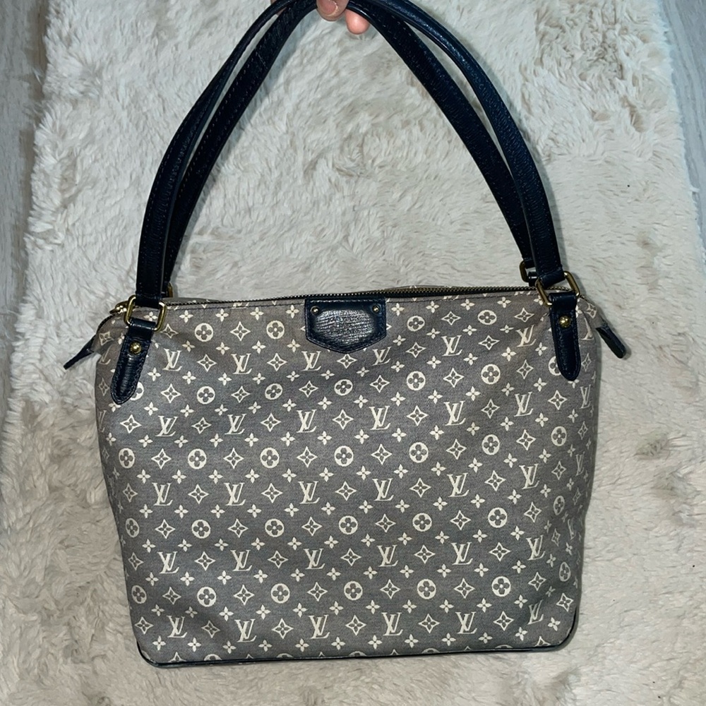 Authentic Louis Vuitton navy blue denim bag preowned.